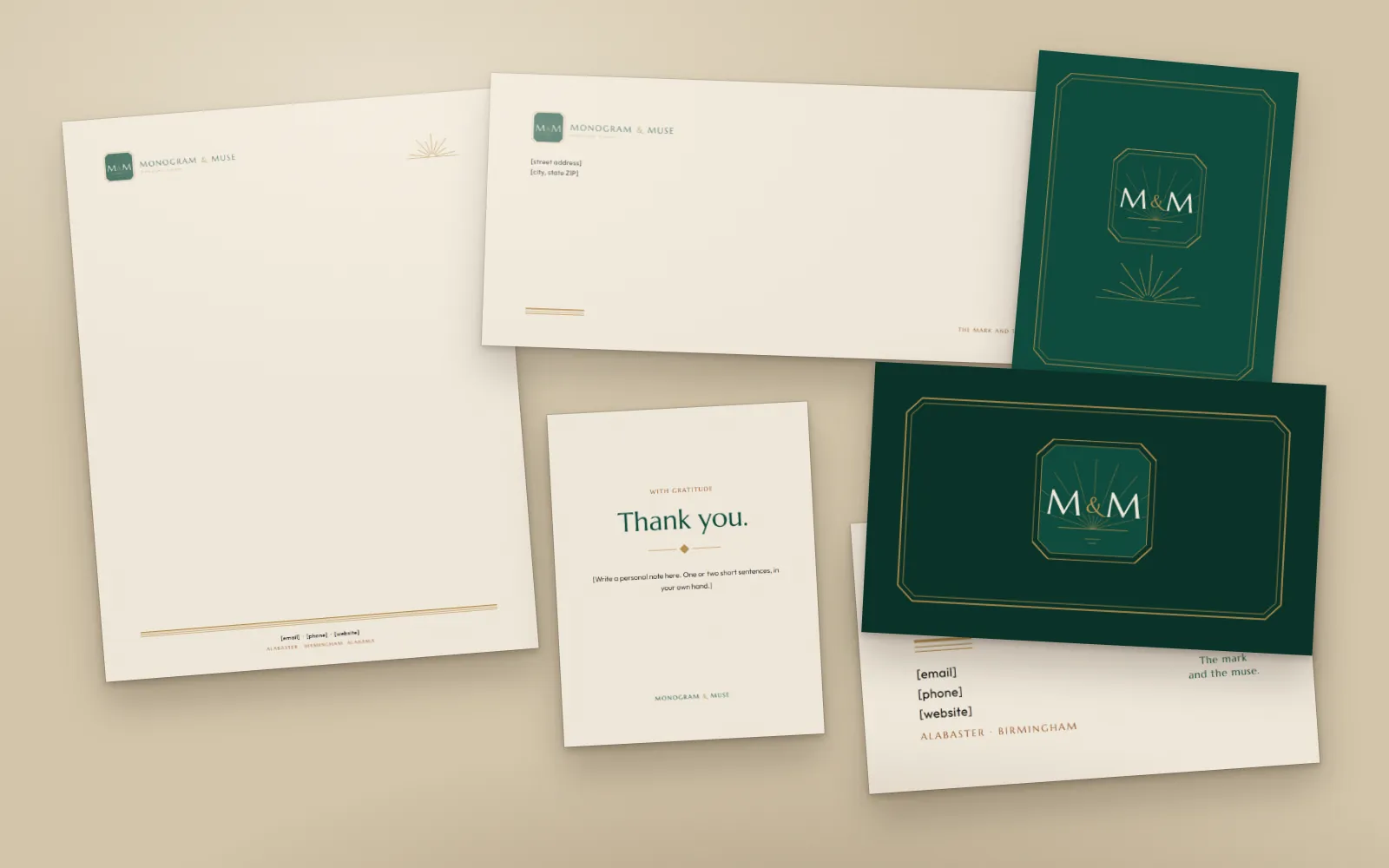 Letterhead, envelope, notecards and business cards on a linen surface.